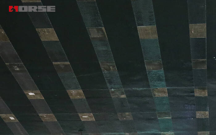Feuille de PRFC collée extérieurement au béton Feuille de PRFC collée extérieurement au béton