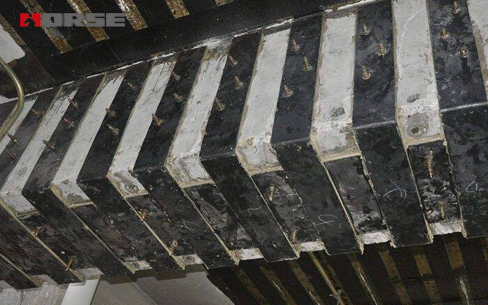 Renforcement de poutres et de poteaux avec des plaques d'acier collées Renforcement de poutres et de poteaux avec des plaques d'acier collées