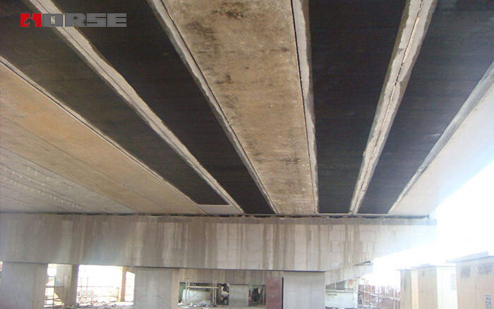 Flexural reinforcement of concrete bridge deck reinforced by CFRP sheet