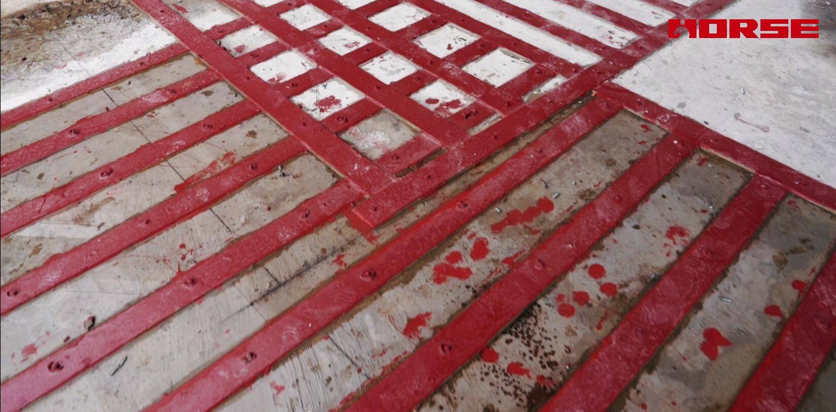 Renforcement de dalle d'un centre de croisière en béton par collage de plaques d'acier