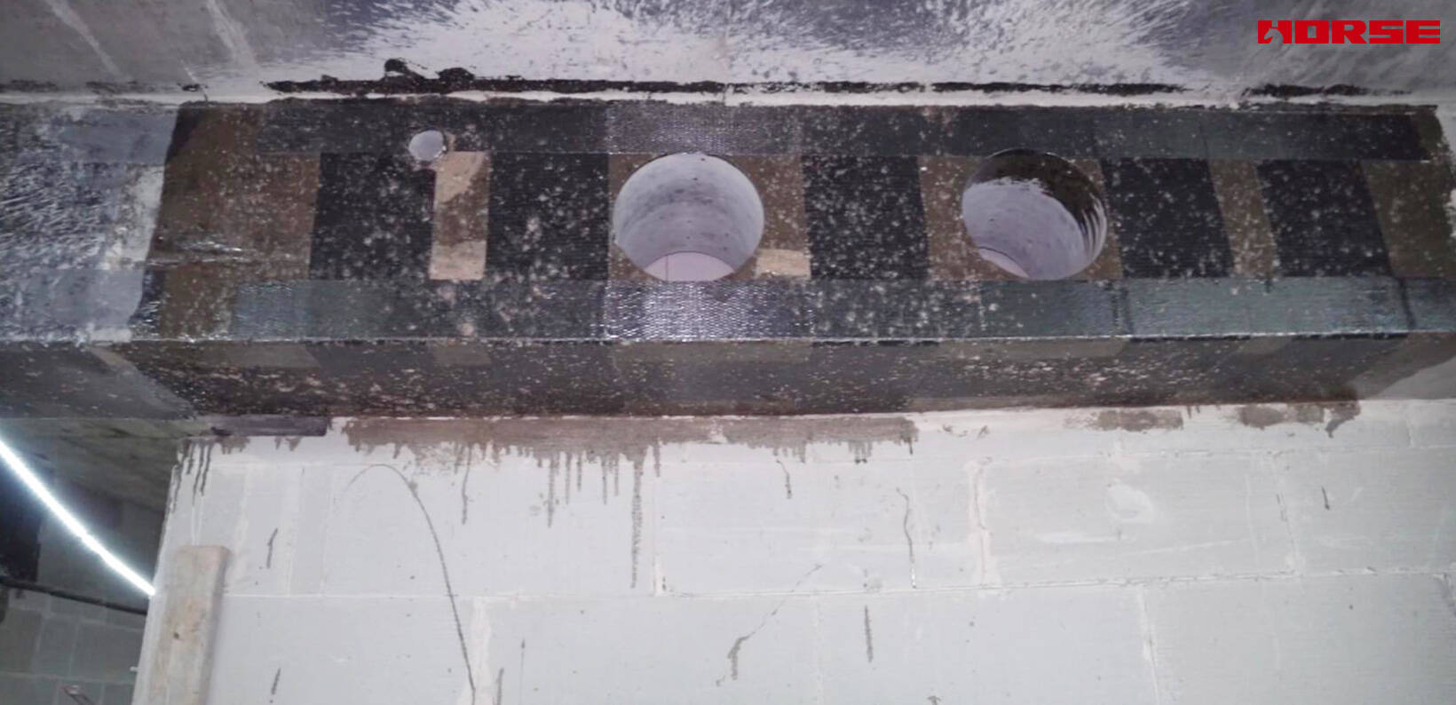 Renforcement des ouvertures de poutres en béton armé par tissus de fibre de carbone
