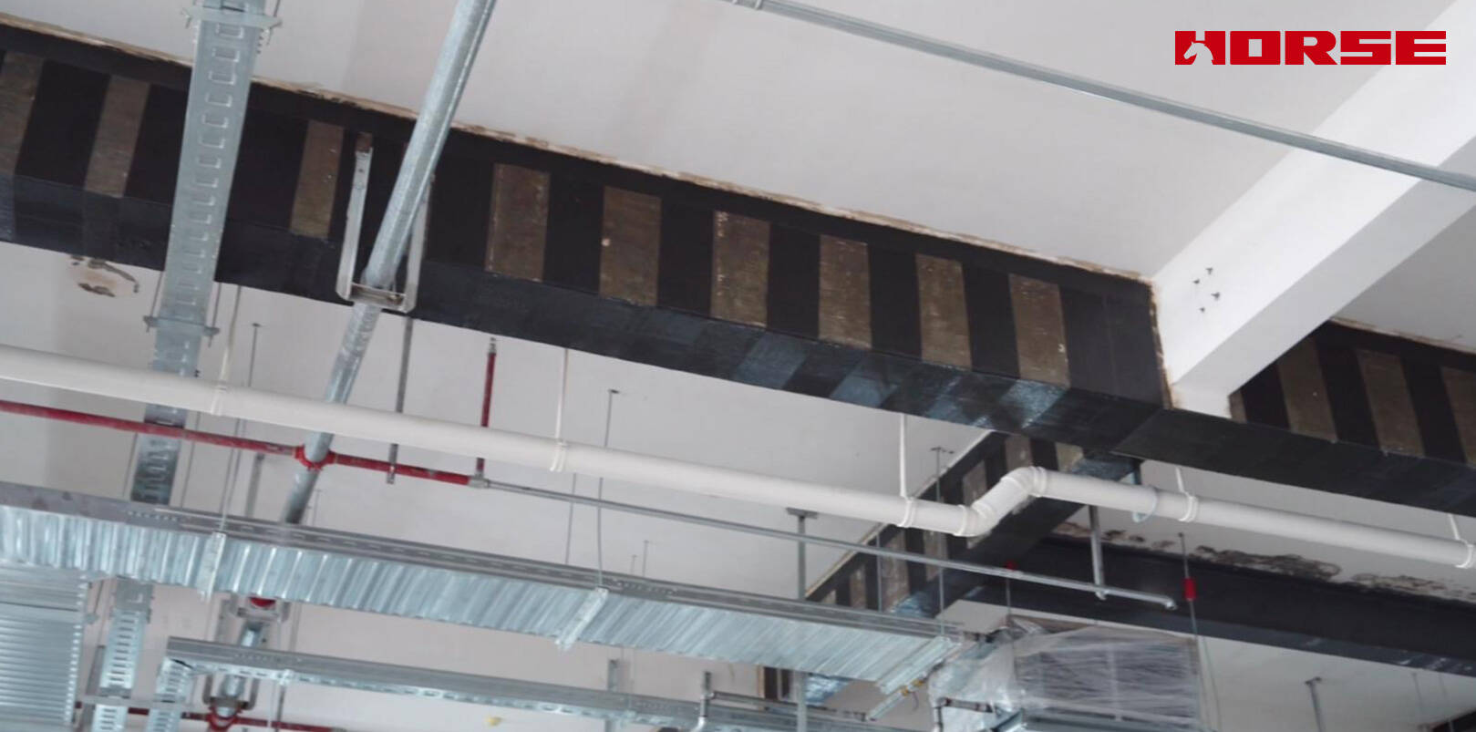Rénovation structurelle avec fibre de carbone après démolition de la dalle