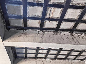 Améliorer la capacité de charge de la dalle en béton par renforcement composite FRP